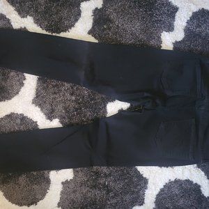 Black stretch pants with holes in knees size 29